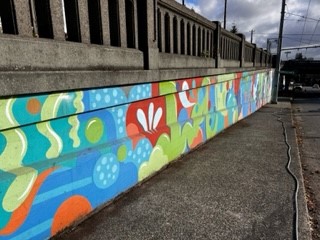 Image of the mural on 46th St Seattle after pressure washing has been finished